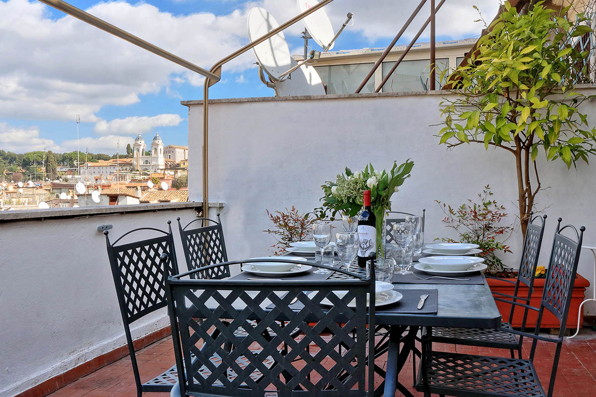 Eat al fresco on your private terrace with a view of the Spanish Steps neighborhood