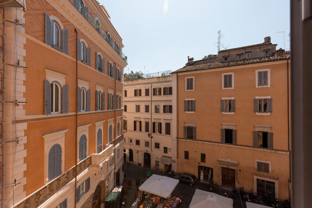 In the heart of Rome, with views of the neighboring palazzos and Piazza del Teatro di Pompeo below